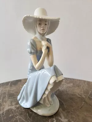 Buy 11  Nao / Lladro - Pensive Girl In Large Sunhat Sitting On A Rock Wall. • 59.99£