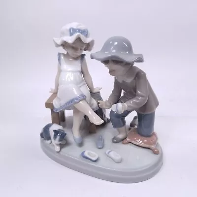 Buy LLADRO Figurine Try This One, With Boy And Girl Trying On Shoes, With Cat Beside • 87.49£
