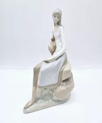 Buy Nao By Lladro Girl Sitting On Rocks With Jug Porcelain Figurine 10  • 41.89£